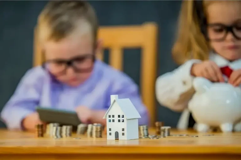 A young child sitting at a table, focusing on counting coins and bills, symbolizing early financial education.