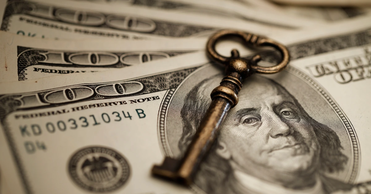 Key resting on U.S. currency, illustrating what is generational wealth planning for families